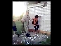 After taking over her town this slutty Ukrainian wife gets raped by 2 Russian soldiers spitroast style while the rest of the squad is watching enviously. They send her away alive but the lower rank soldiers are a bit disappointed they weren`t allowed to have a go.